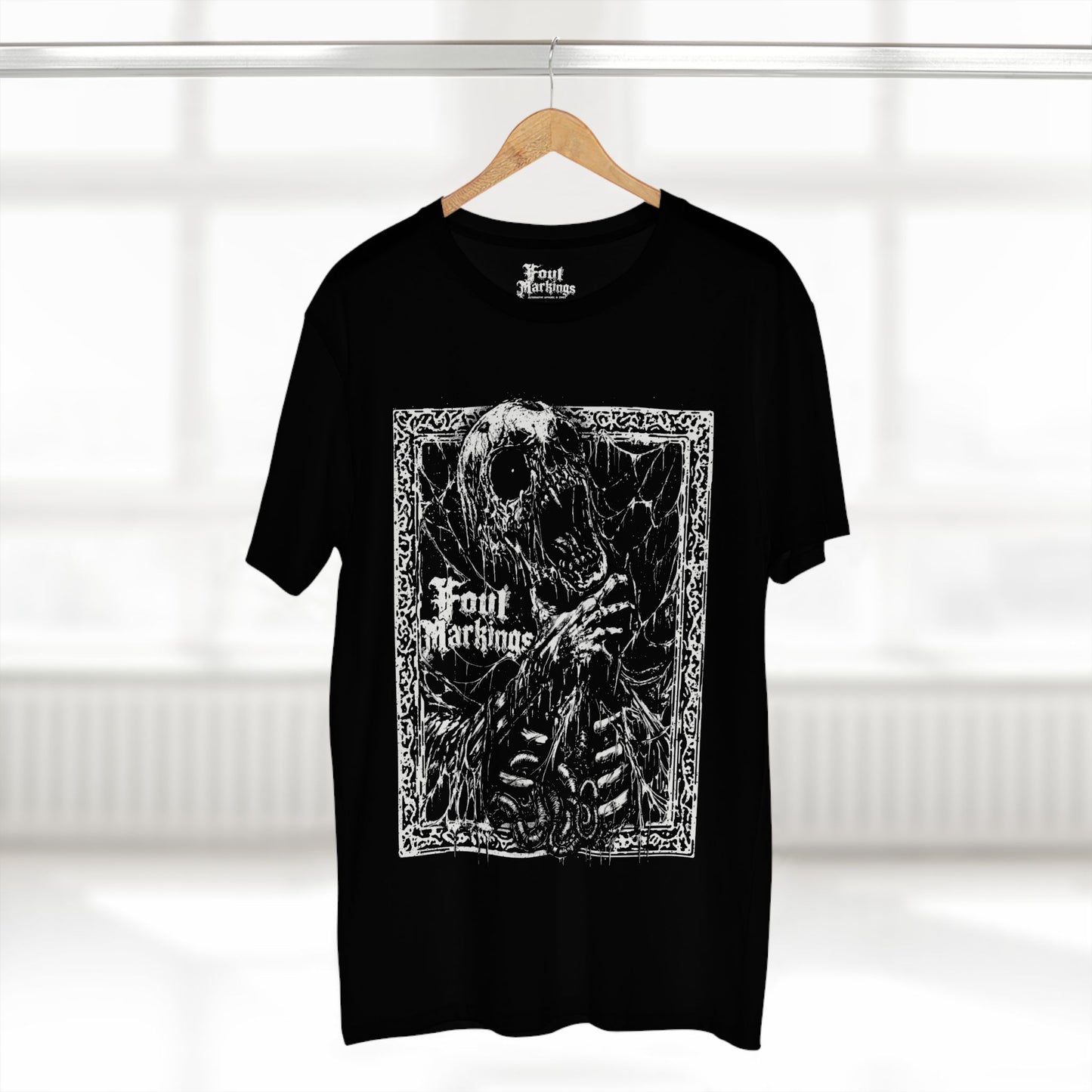 Black skeleton print tee shown hanging