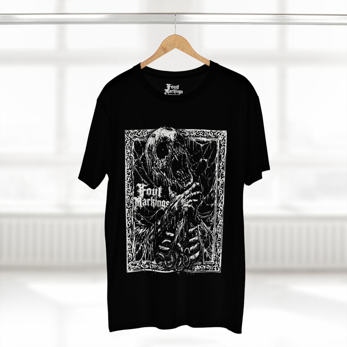 Black skeleton print tee shown hanging