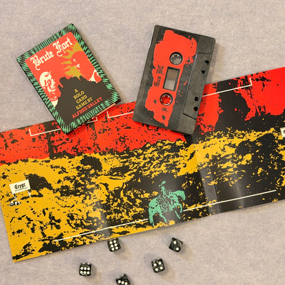 Brute Fort card box, cassette and unfolded dungeon map insert with dice