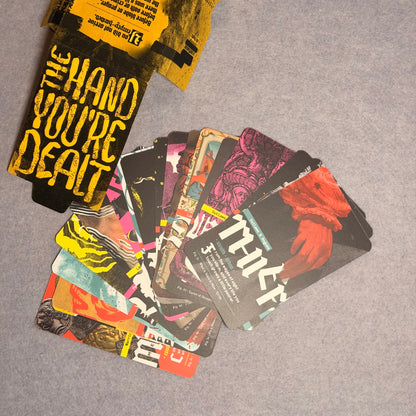The Hand You're Dealt sleeve with a fan of background cards, Thief on top