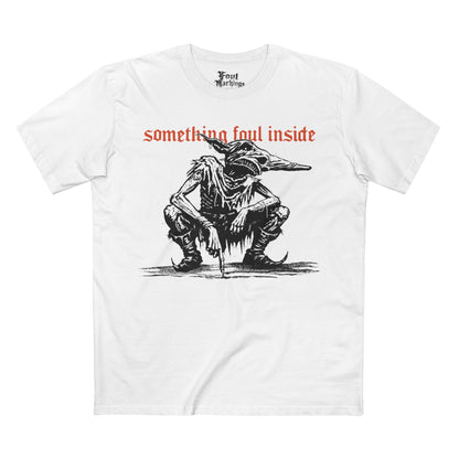 White tee with a black ink crouching goblin under red gothic text reading something foul inside, front view