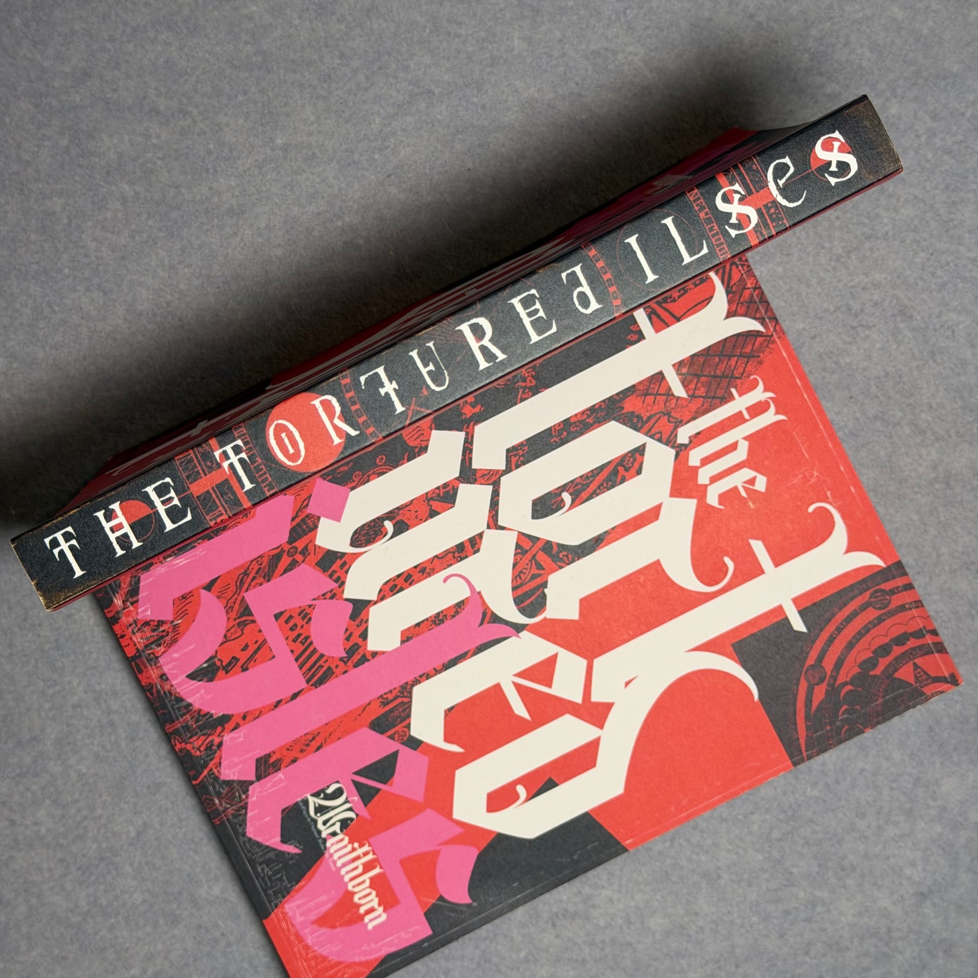 Softcover at an angle showing the printed spine and the front cover